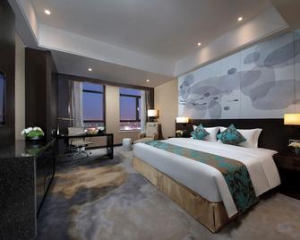 Shenyang Huaqiang Novlion Hotel - Шеньян - Спальня