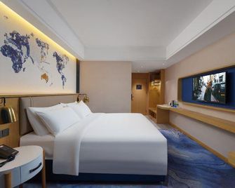 Longcheng Big Hotel(Jiujiang Pengze Longcheng Avenue) - Jiujiang - Bedroom