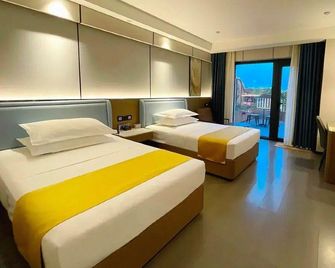 Heguang Tongcheng Hotel - Hotan - Camera da letto