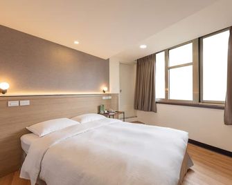 نيو وورلد هوتل - مدينة تايبيه - غرفة نوم