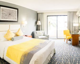 Century Hotel - Garapan - חדר שינה