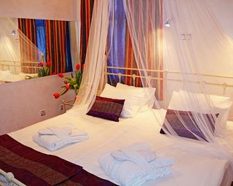 إن بي هوتل - ريغا - غرفة نوم