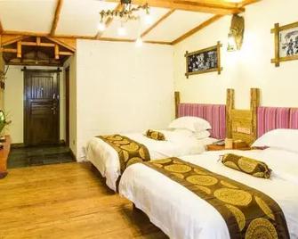 Zhangjiajie Yueranju Hostel - Zhangjiajie - Schlafzimmer