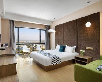 Ouye Boutique Hotel - Qujing - Habitación