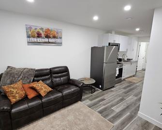 New decently furnished one bedroom suit at Rochdale Boulevard - Regina - Living room