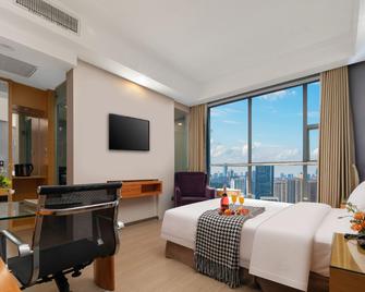 Xiangyang Hechi Shang Pin Hotel - Xiangyang - Bedroom