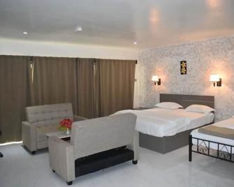 Galaxy Hotels & Apartments - Labasa - Yatak Odası