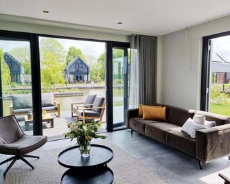 Luxurious detached water villa with jetty - Balk - Living room