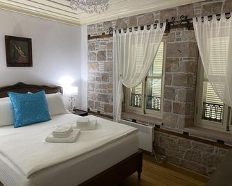 Nisi Butik Hotel - אייבאליק - חדר שינה