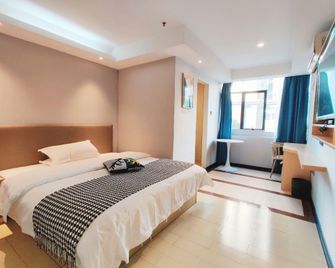 Junyi Hostel - Cantón - Habitación