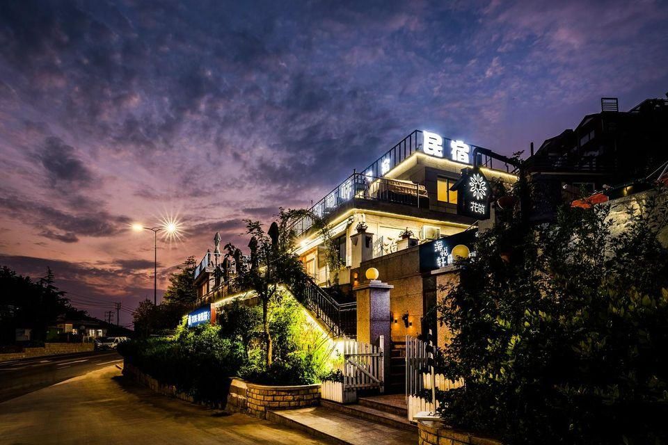 Floral Hotel· Qingdao Haiyuexuan Hotel (Lushan Scenic Area Lushan Beach Branch) - تشينغداو - غرفة نوم