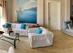 Luxurious Villa, designer's pool, lighted tennis court, olive grove, sea views. - Paleo Tsifliki - Living room