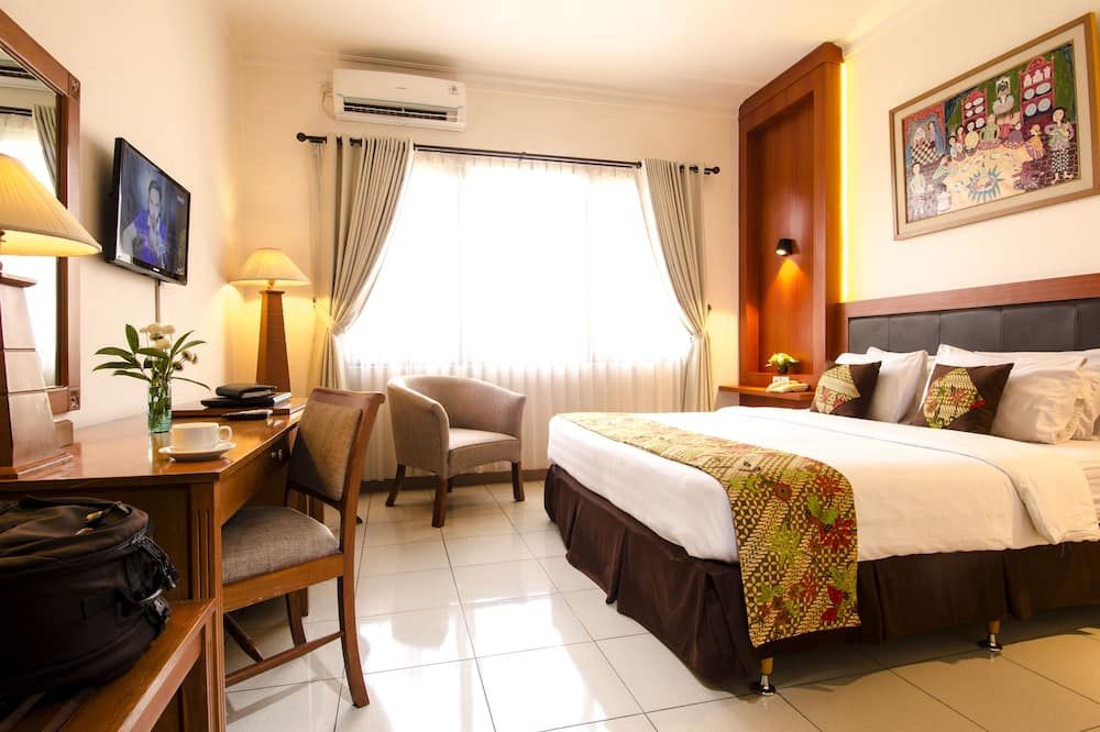 Griya Sentana Malioboro Hotel - יוגיאקרטה - חדר שינה