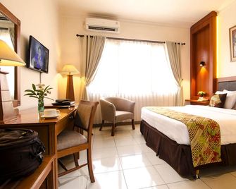 Griya Sentana Malioboro Hotel - Yogyakarta - Bedroom