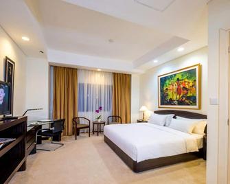 Sintesa Peninsula Hotel Palembang - Palembang - Phòng ngủ