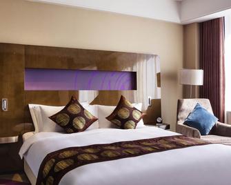 Novotel Daqing Haofang - Daqing - Schlafzimmer