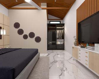 Corbett Jungle Breeze Resort - Rāmnagar - Ložnice