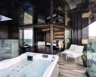 إتش هوتل - ست جوليانس - غرفة نوم