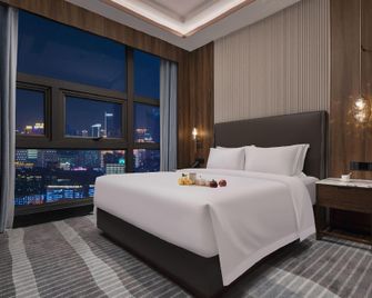 Kang Nian Shi Jia Hotel - تشانغشا - غرفة نوم