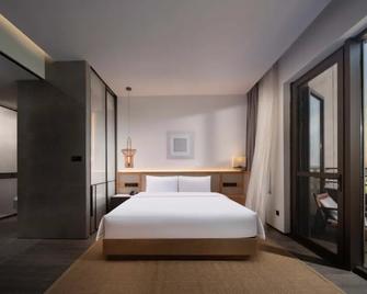 S&N Hotel Wucheng - Jiujiang - Schlafzimmer