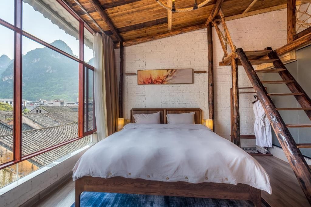 Yangshuo Autumn Inn - גילין - חדר שינה
