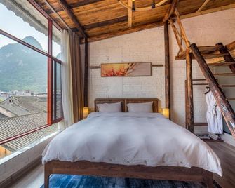 Yangshuo Autumn Inn - Guilin - Schlafzimmer