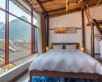 Yangshuo Autumn Inn - גילין - חדר שינה