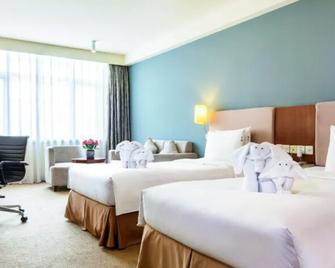 Tianjin Binhai Saint Light Hotel - Tianjin - Schlafzimmer