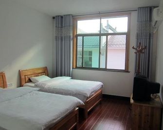 Wuyuan Shicheng Lingyan Inn - Джіндежен - Спальня