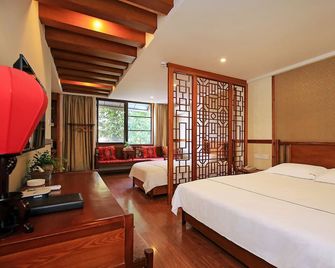 Guilin Gunanmen Hotel - גילין - חדר שינה