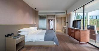 Jade Crystal Hotel (Taizhou Ocean Plaza) - Taizhou - Bedroom