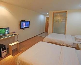 Wanjia Business Hotel - Huangshan - Kamar Tidur