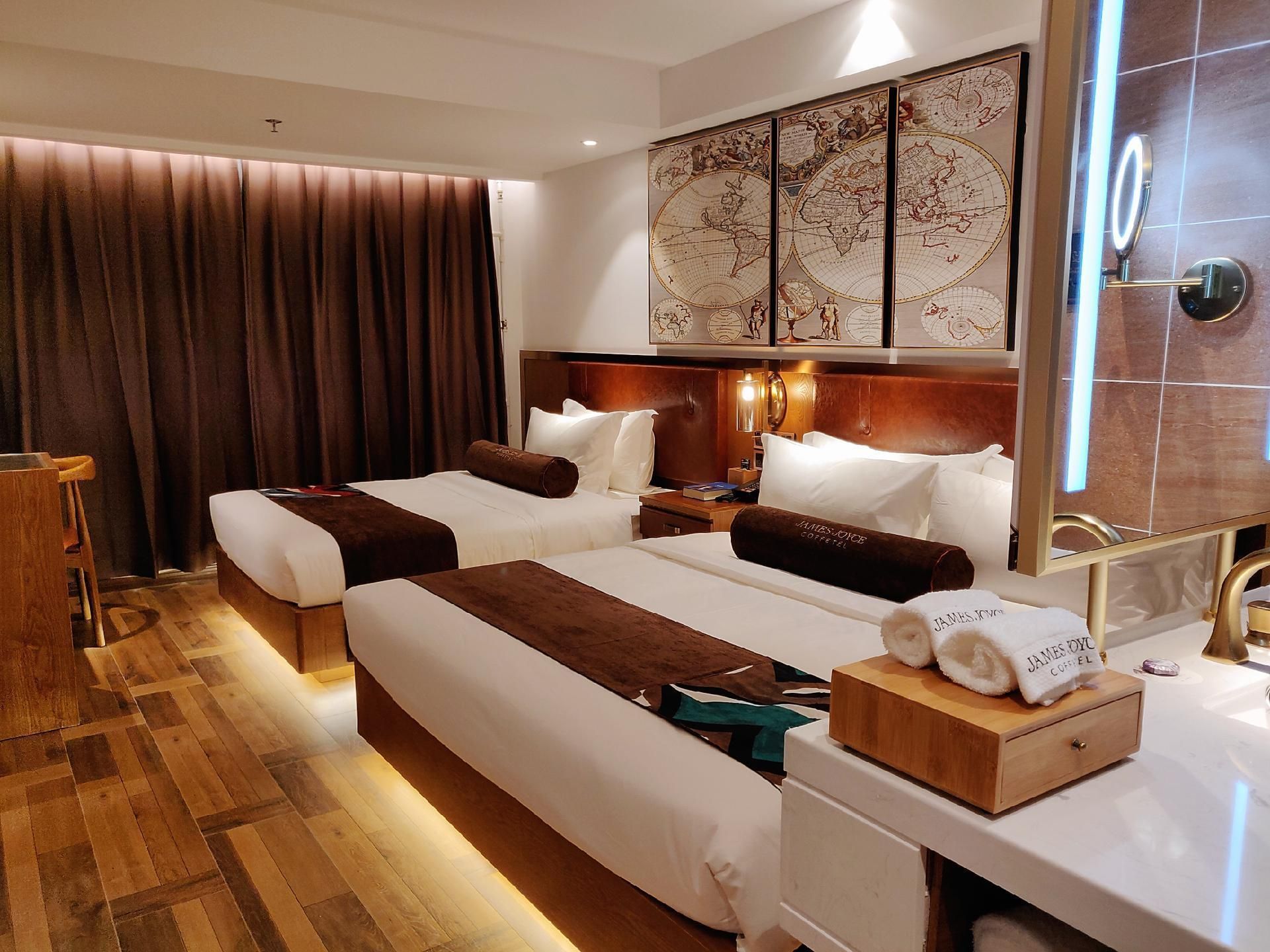 James Joyce Coffetel Qingdao Taidong Pedestrian Street Yingkou Road - تشينغداو - غرفة نوم