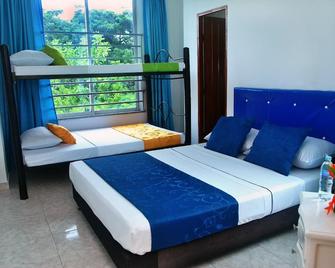 Ayenda Hotel Roisa - Girardot - Schlafzimmer