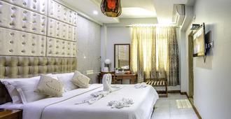 Newtown Inn - Malé - Bedroom