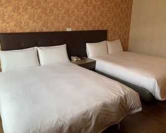 Hoping Mori Hotel - Xiulin Township - Schlafzimmer