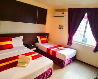 City Inn - Kuching - Bedroom