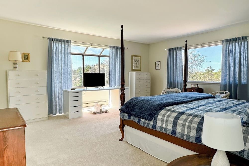 Bright and airy home with sunset views less than a mile to the lake and village