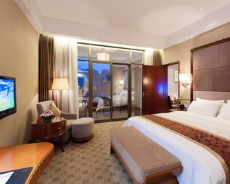 Zigong Tanmulin Hotel - Zigong - Bedroom