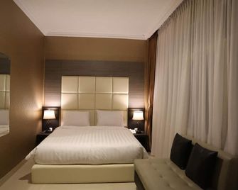 هوتيل 55 - جاكرتا - غرفة نوم