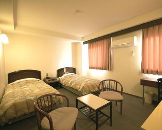 Purple Hotel Futsukaichi - Chikushino - Slaapkamer