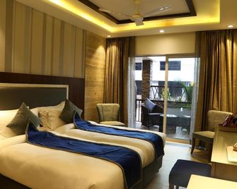 The Flora Residency - كالانغوت - غرفة نوم