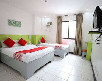 OYO 210 Apple Tree Suites - סבו סיטי - חדר שינה