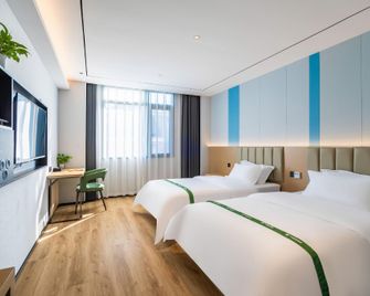 Vatica Wuhu Nanling County Wannan Shopping Mall Hotel - Wuhu - Bedroom