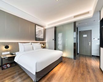 Tiangang Manfei Hotel (Ningbo Railway Station Lianfeng Metro Station Branch) - Ningbo - Bedroom