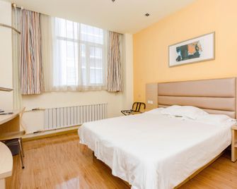 Grace Inn Dezhou Central Square - Dezhou - Schlafzimmer