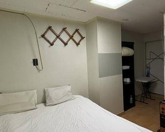 Sunrise Inn - Seúl - Habitación