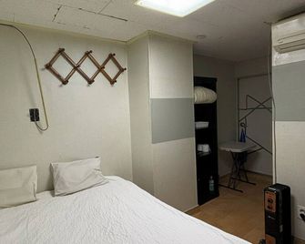 Sunrise Inn - Seoul - Schlafzimmer