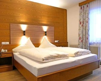 Hotel Grieserhof - לרמוז - חדר שינה