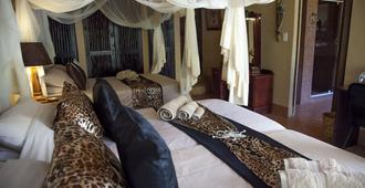 African Rock Lodge - הודספרוט - חדר שינה